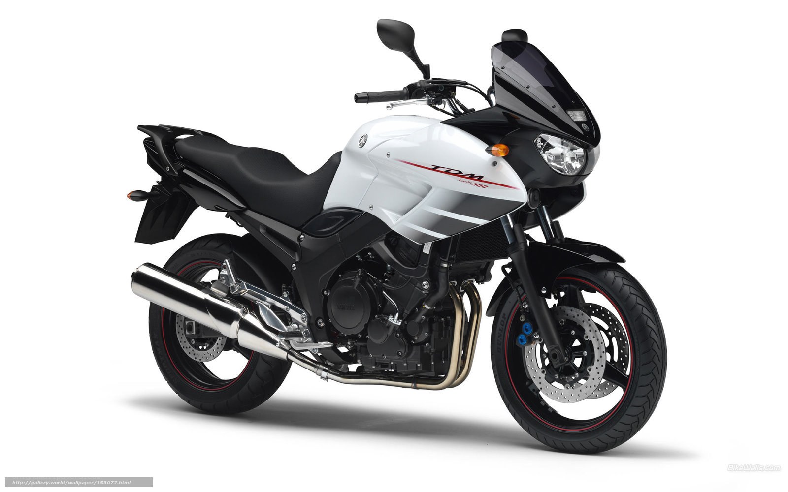 White and black Yamaha TDM motorcycle