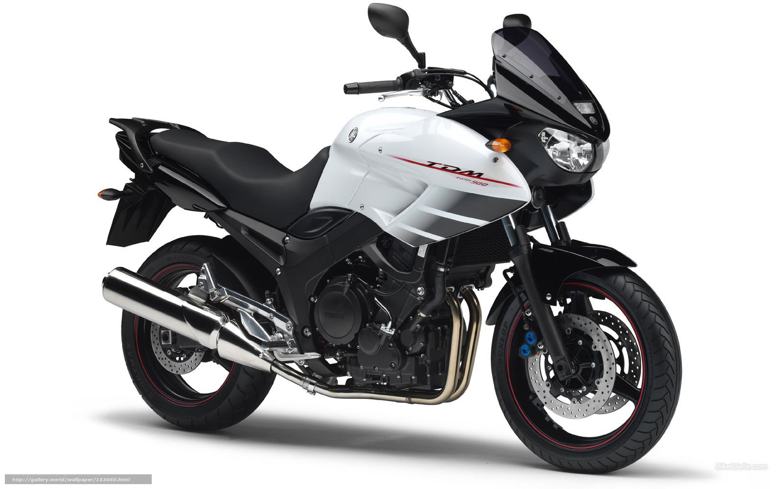 White and black Yamaha TDM motorcycle