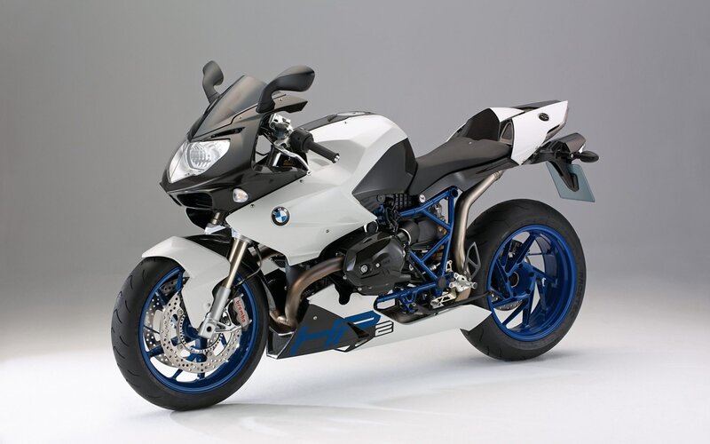 white and blue BMW sport motorcycle