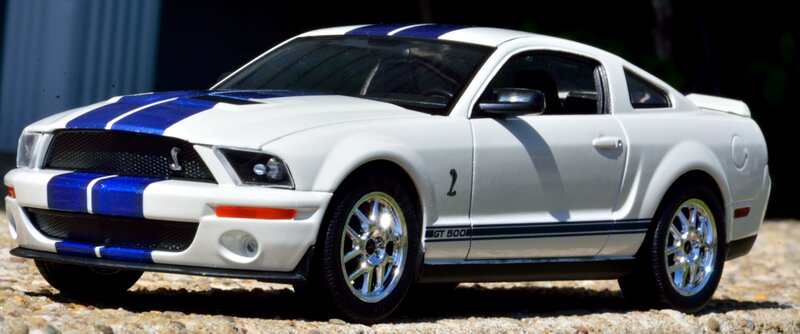 White and Blue Model Car — Dramatic