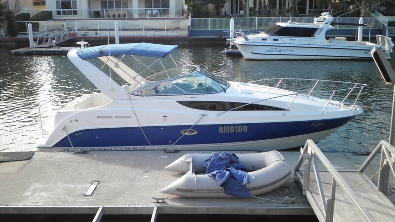 White and Blue Motorboat — Calm
