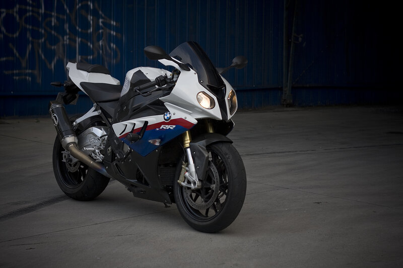 White and Blue Motorcycle — Dramatic, Photograph, Graffiti Wall