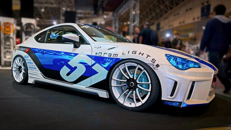 White and Blue Race Car — Dramatic, Photograph, People