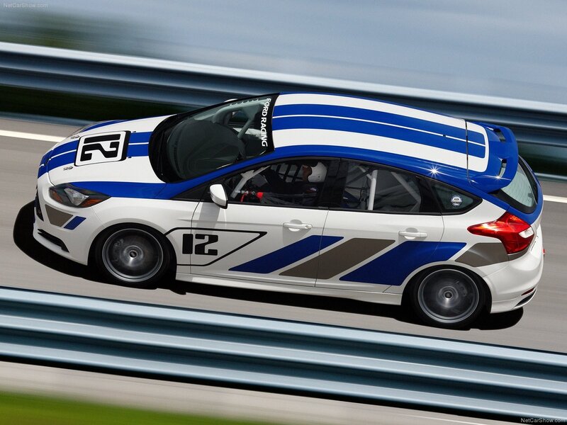 white and blue race car on track