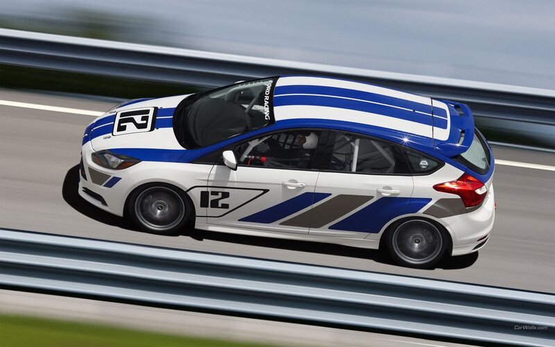 white and blue race car on track