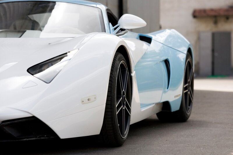 white and blue sports car