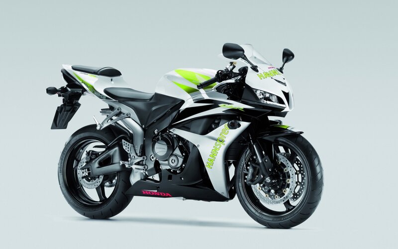 white and green sport motorcycle