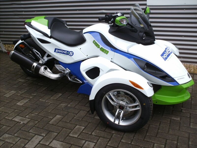 White and Green Three-wheeled Vehicle