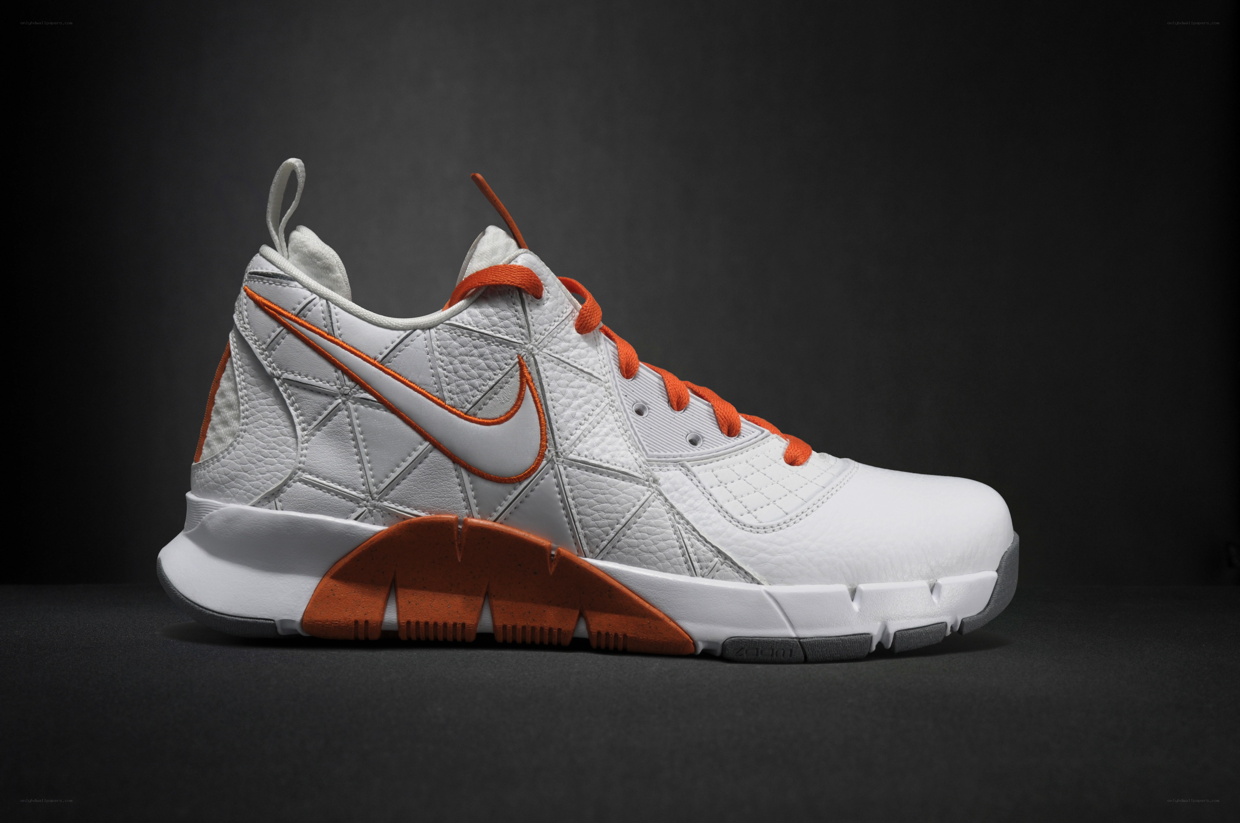 white and orange Nike sneaker
