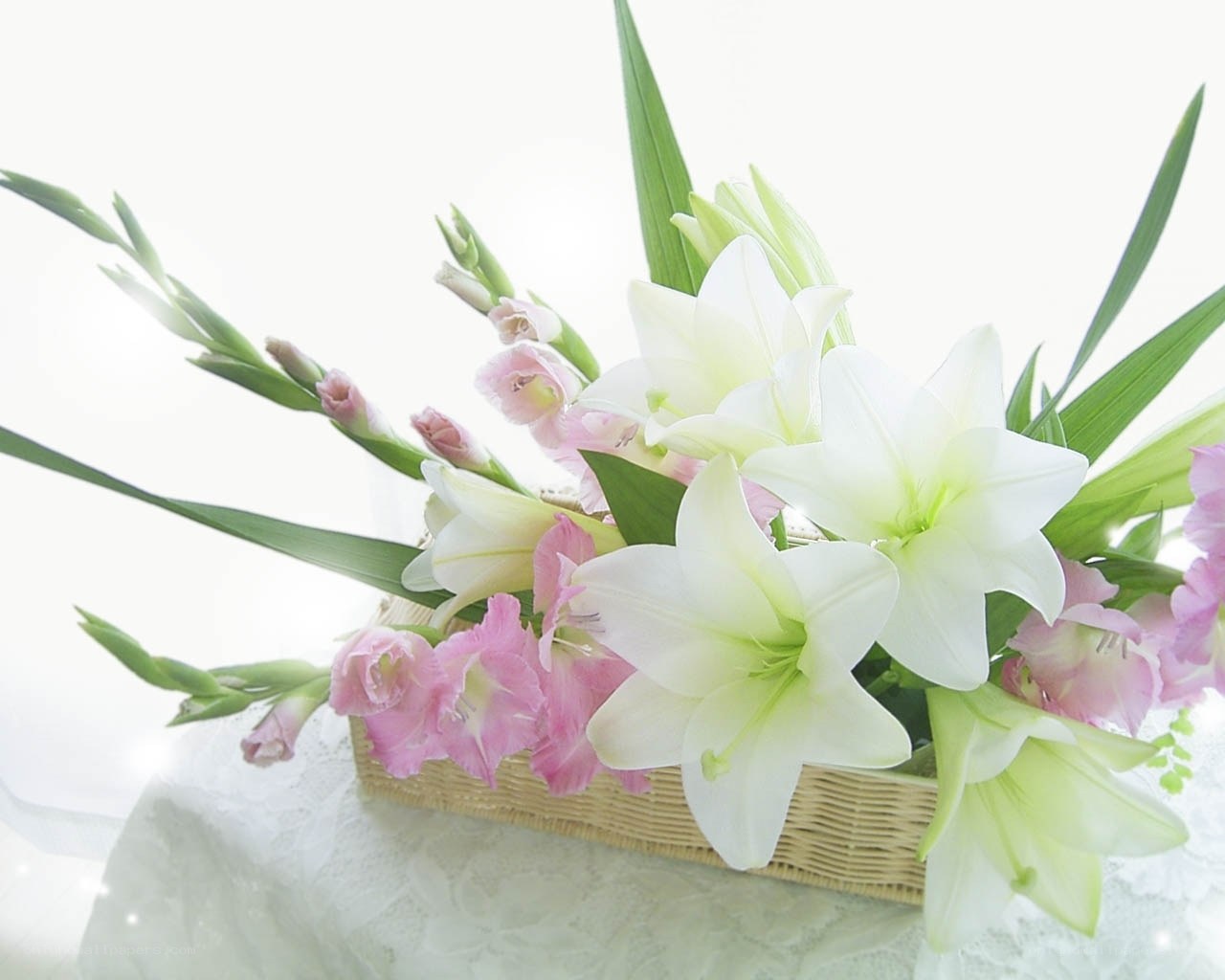 White and pink lilies in basket