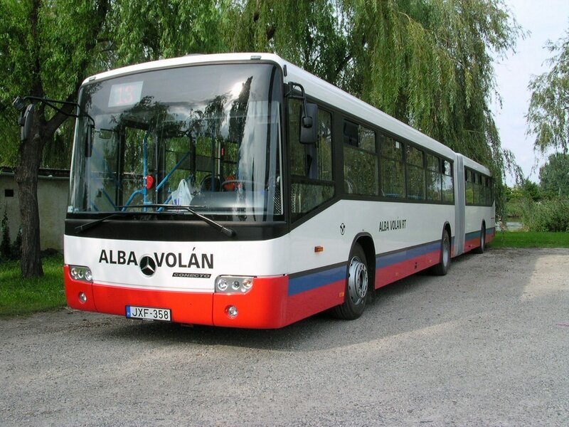 White and red articulated bus