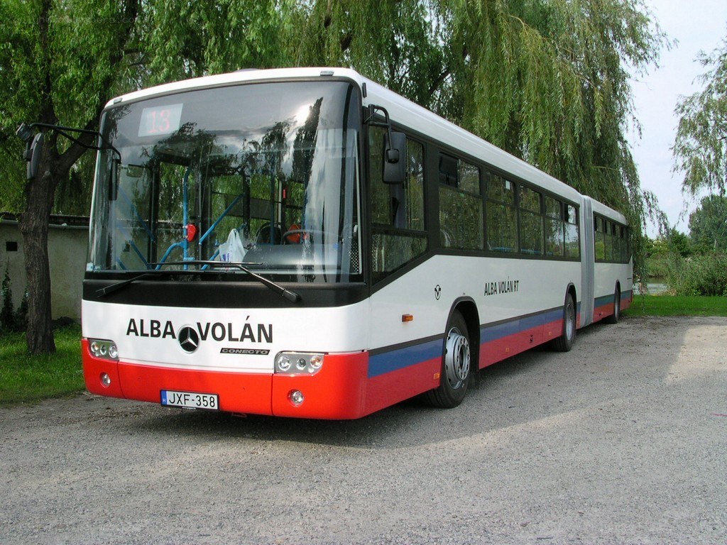 White and red articulated bus