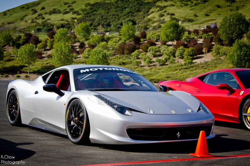 White and red Ferraris on track