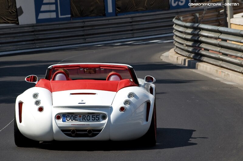 White and red sports car on track
