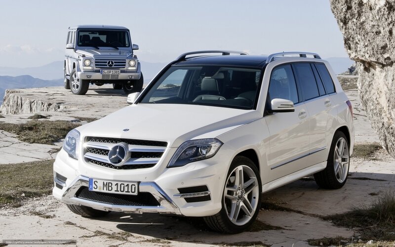 White and silver Mercedes-Benz SUVs