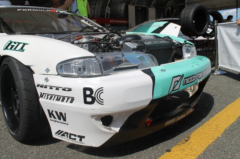White and Teal Race Car — Active