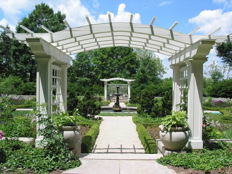 White arbor in a formal garden