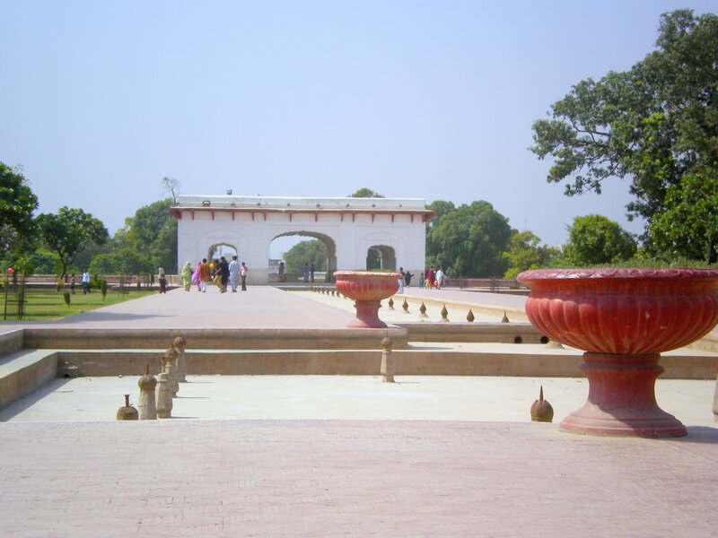white archway in garden