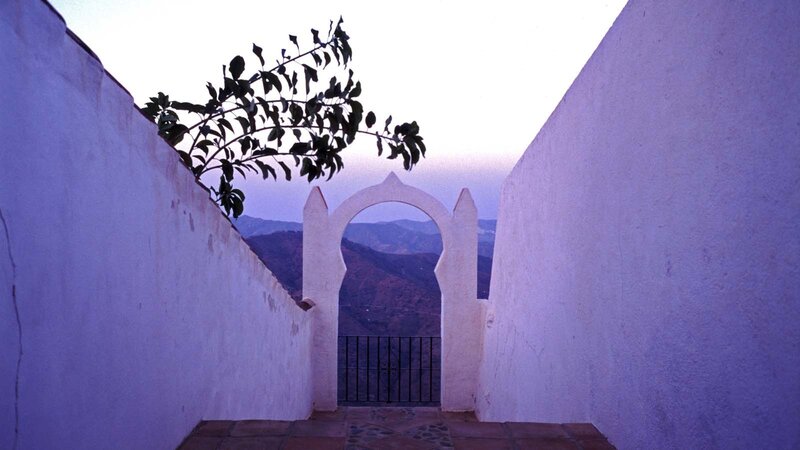 White archway overlooking mountains