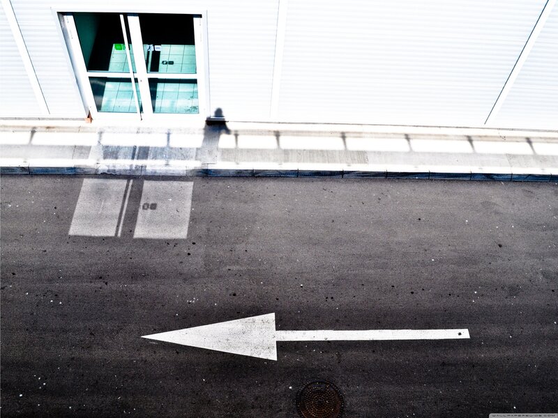 White Arrow on Asphalt
