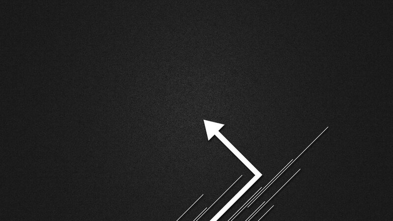 white arrow on dark background