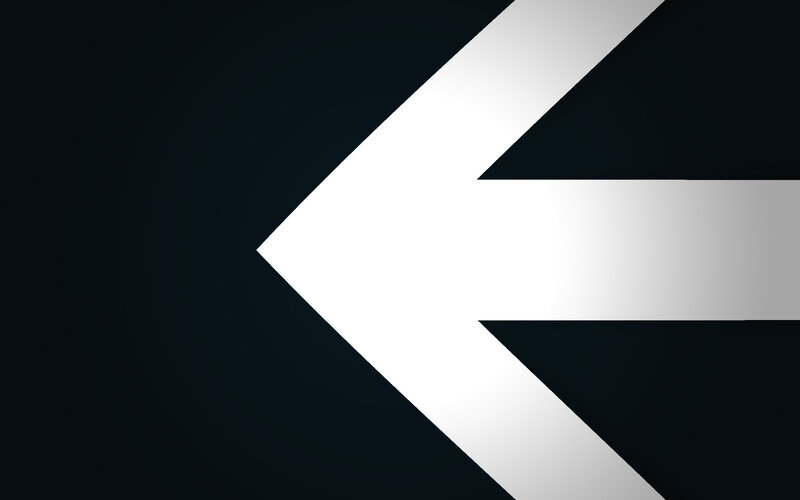 white arrow on dark background
