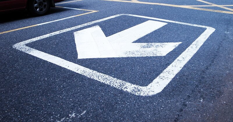 White Arrow on Pavement