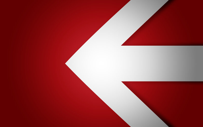 white arrow on red background