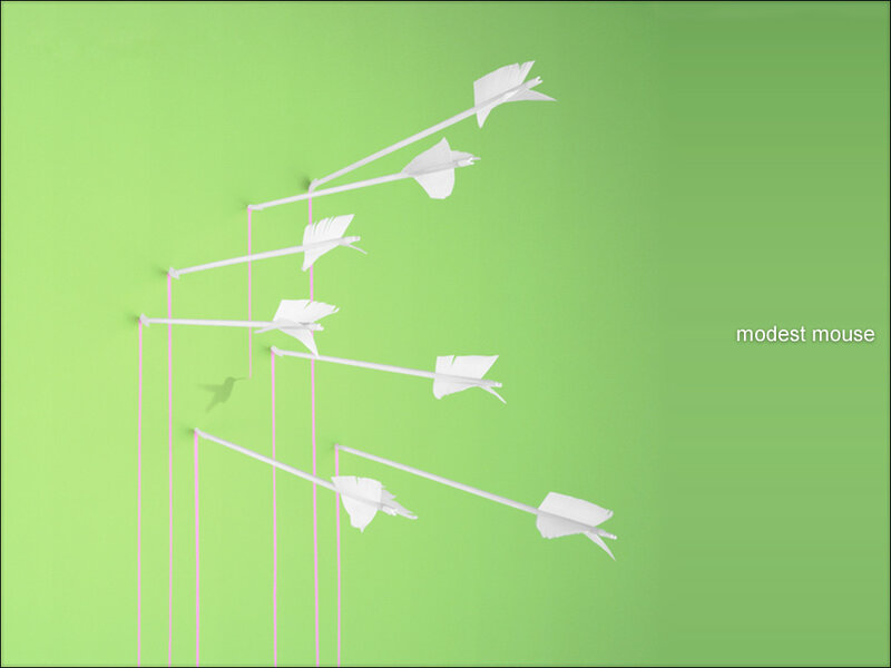 white arrows on green background