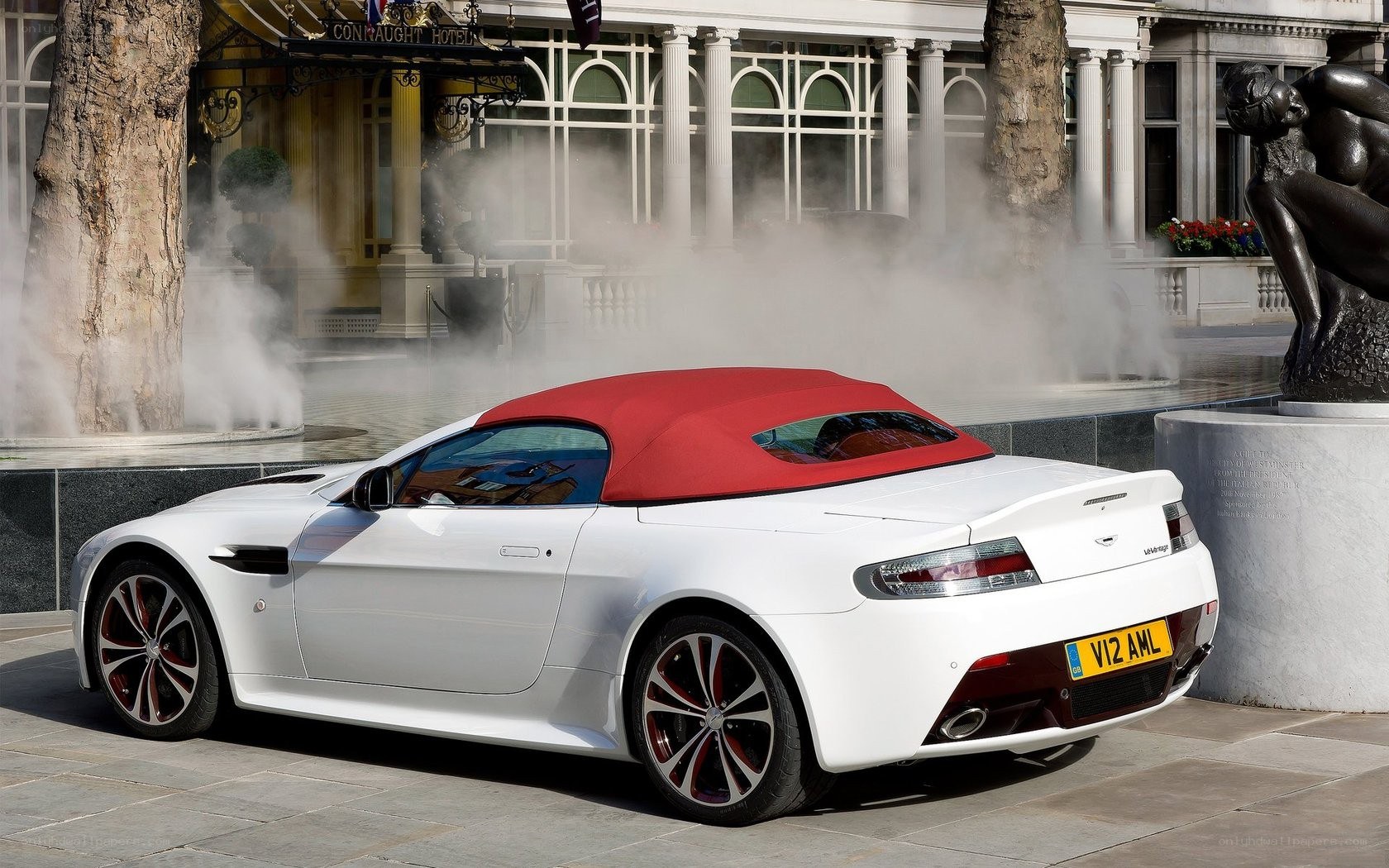 White Aston convertible at hotel