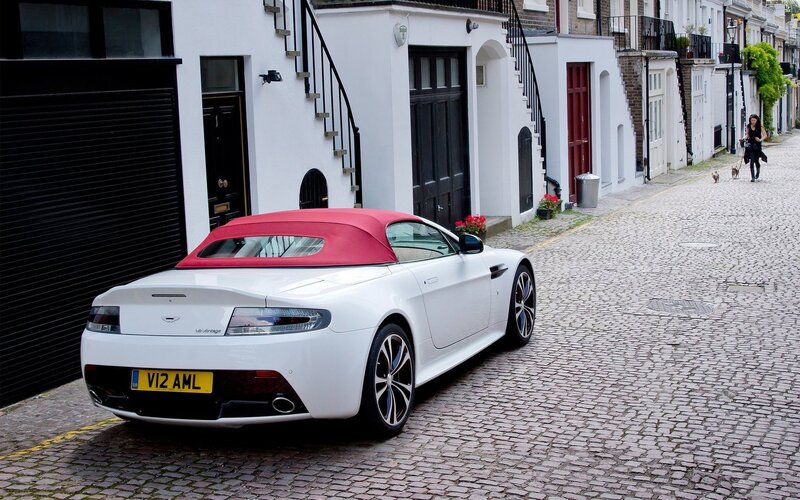 White Aston convertible on cobblestone street