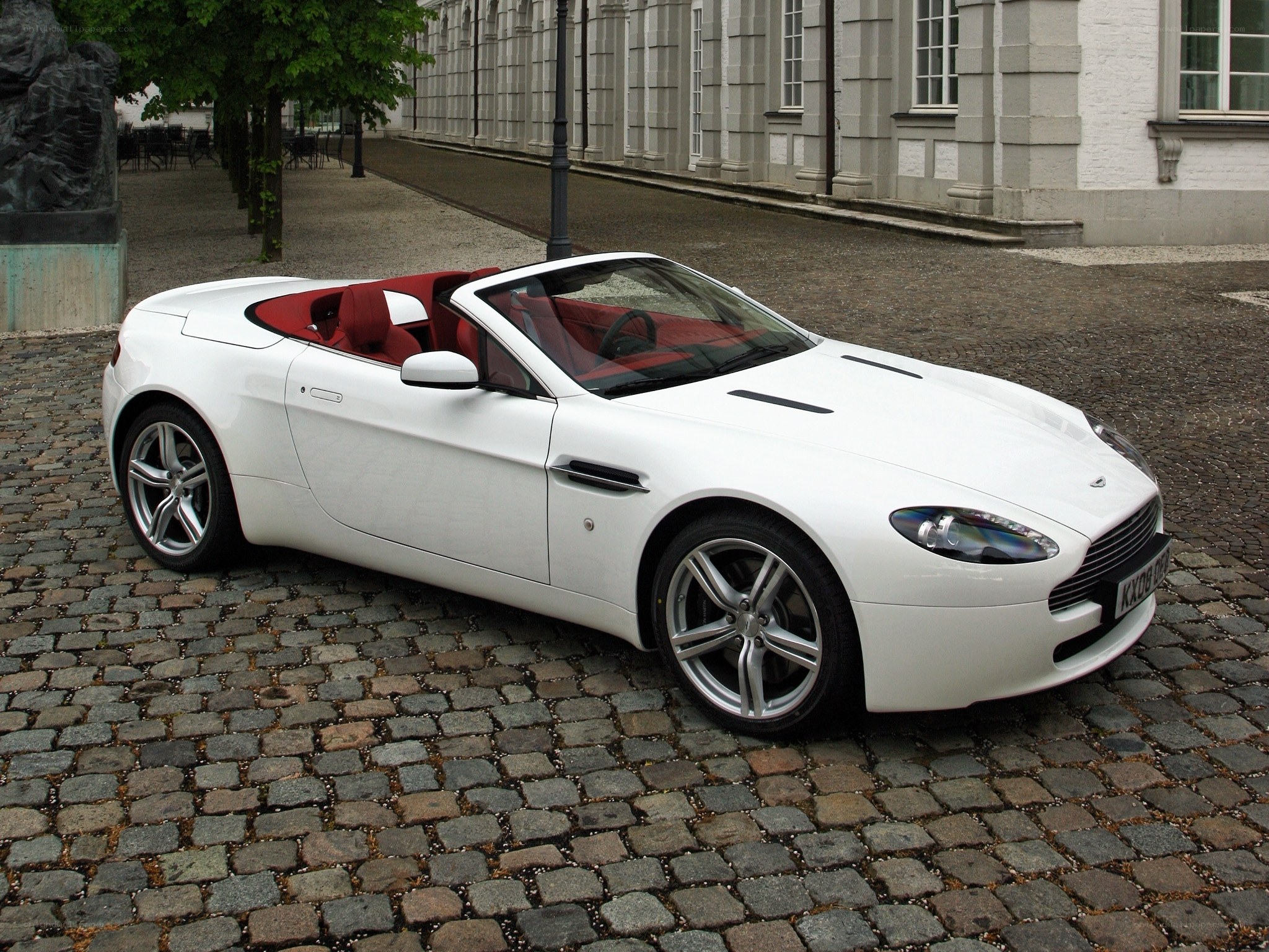 White Aston convertible on cobblestones