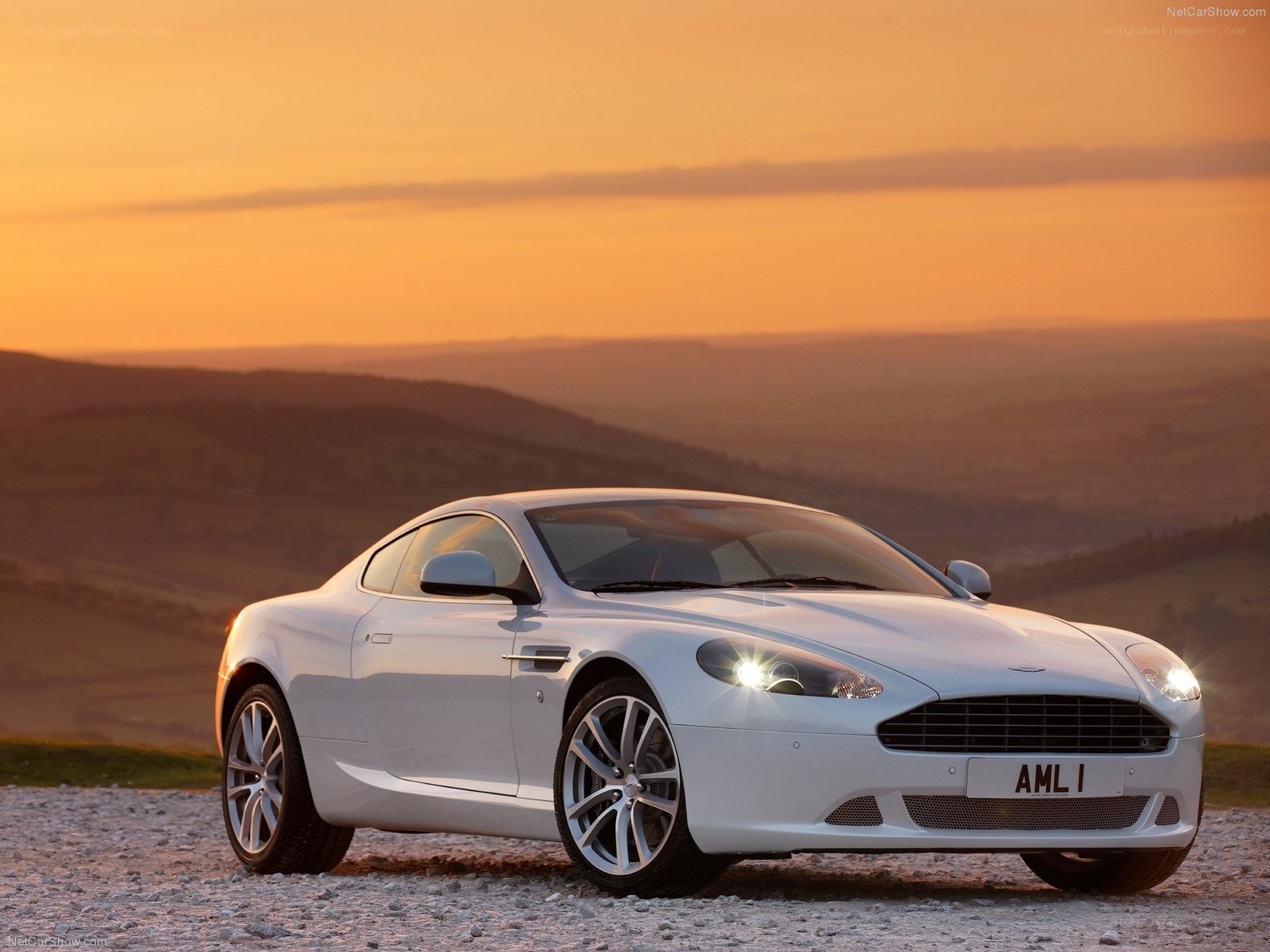 White Aston DB9 at sunset