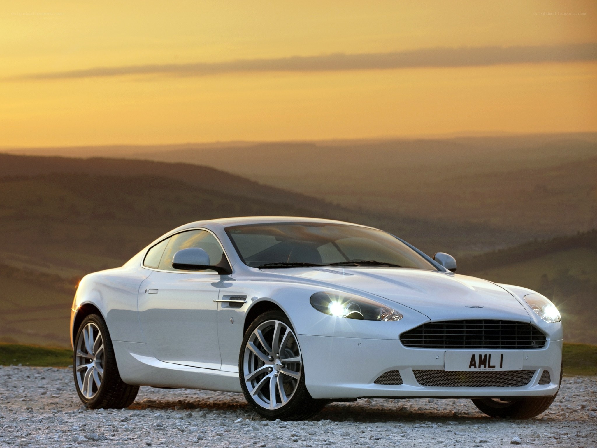 White Aston DB9 at sunset