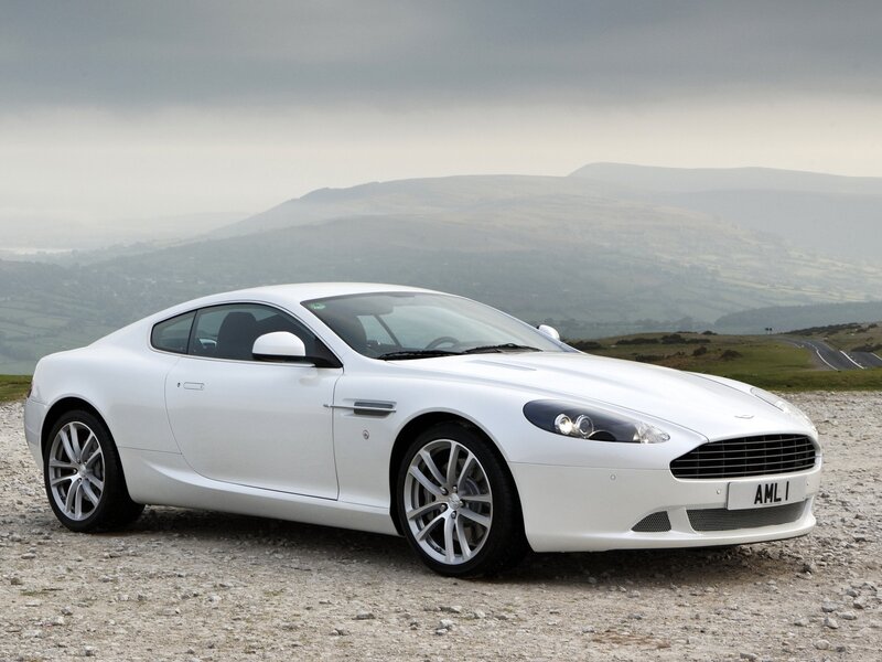 White Aston DB9 on a hillside