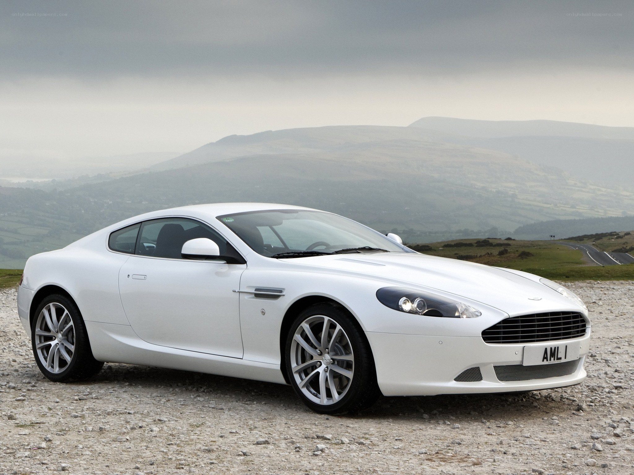 White Aston DB9 on a hillside
