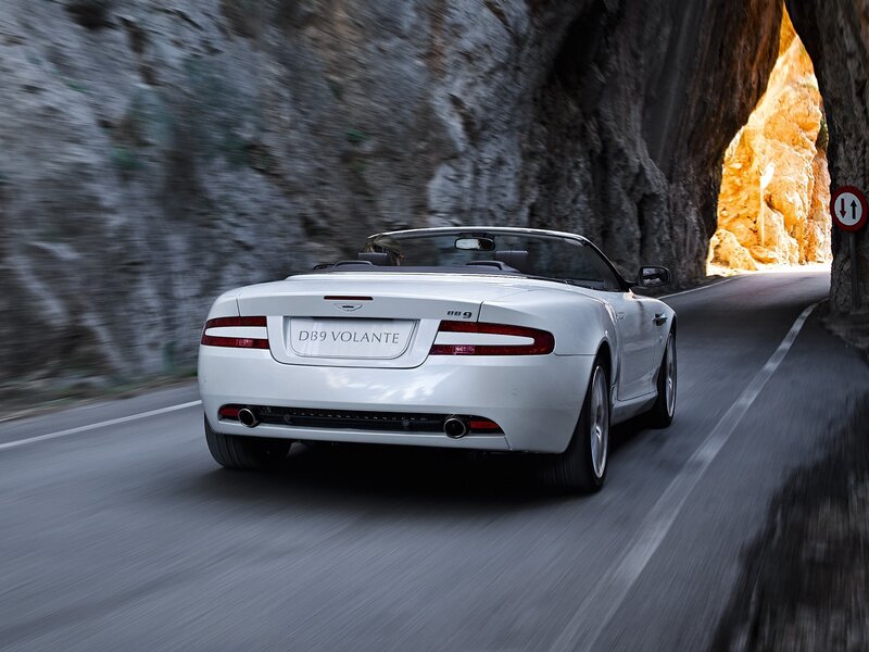 White Aston DB9 Volante driving