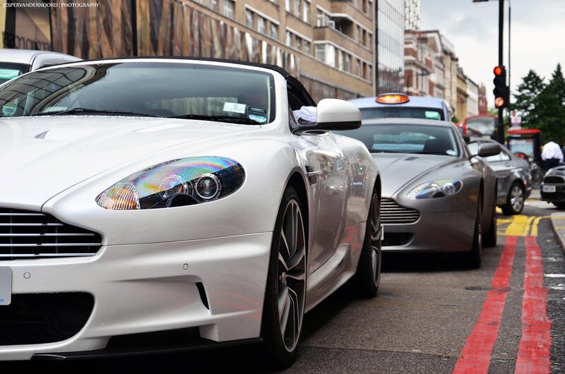 White Aston in city traffic