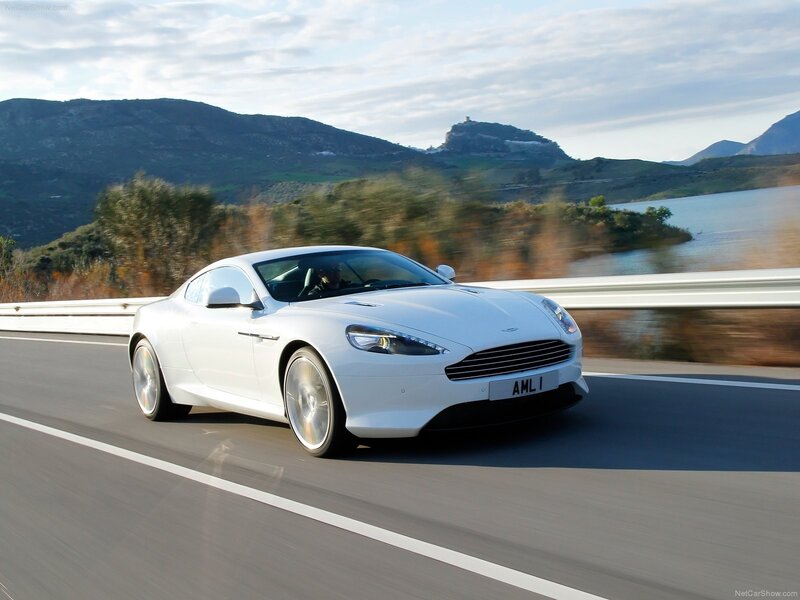 white aston martin driving on road