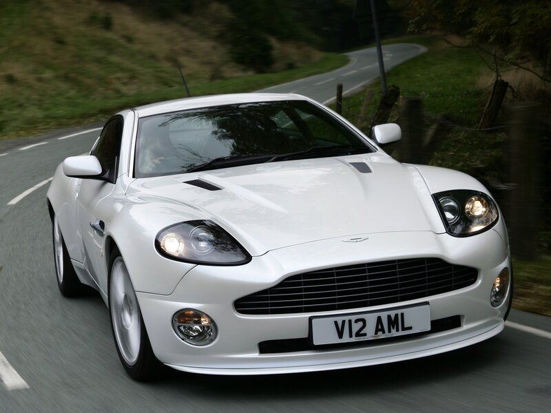 white aston martin driving