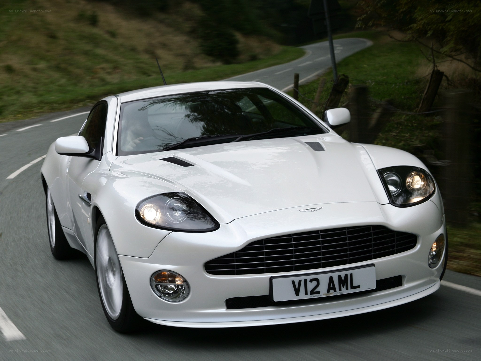 white aston martin driving