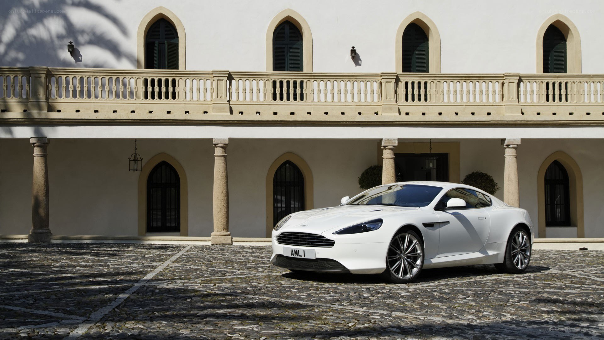 White Aston Martin in courtyard