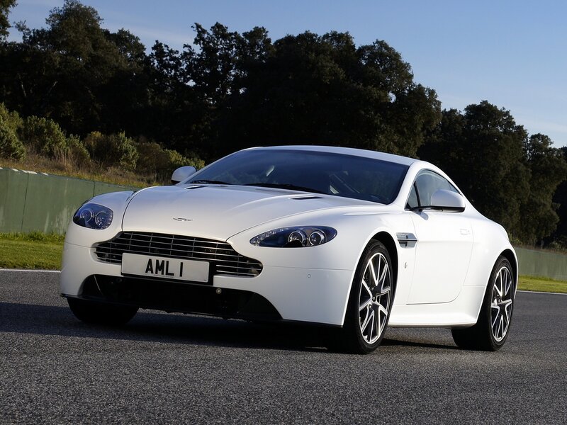 White Aston Martin on a racetrack