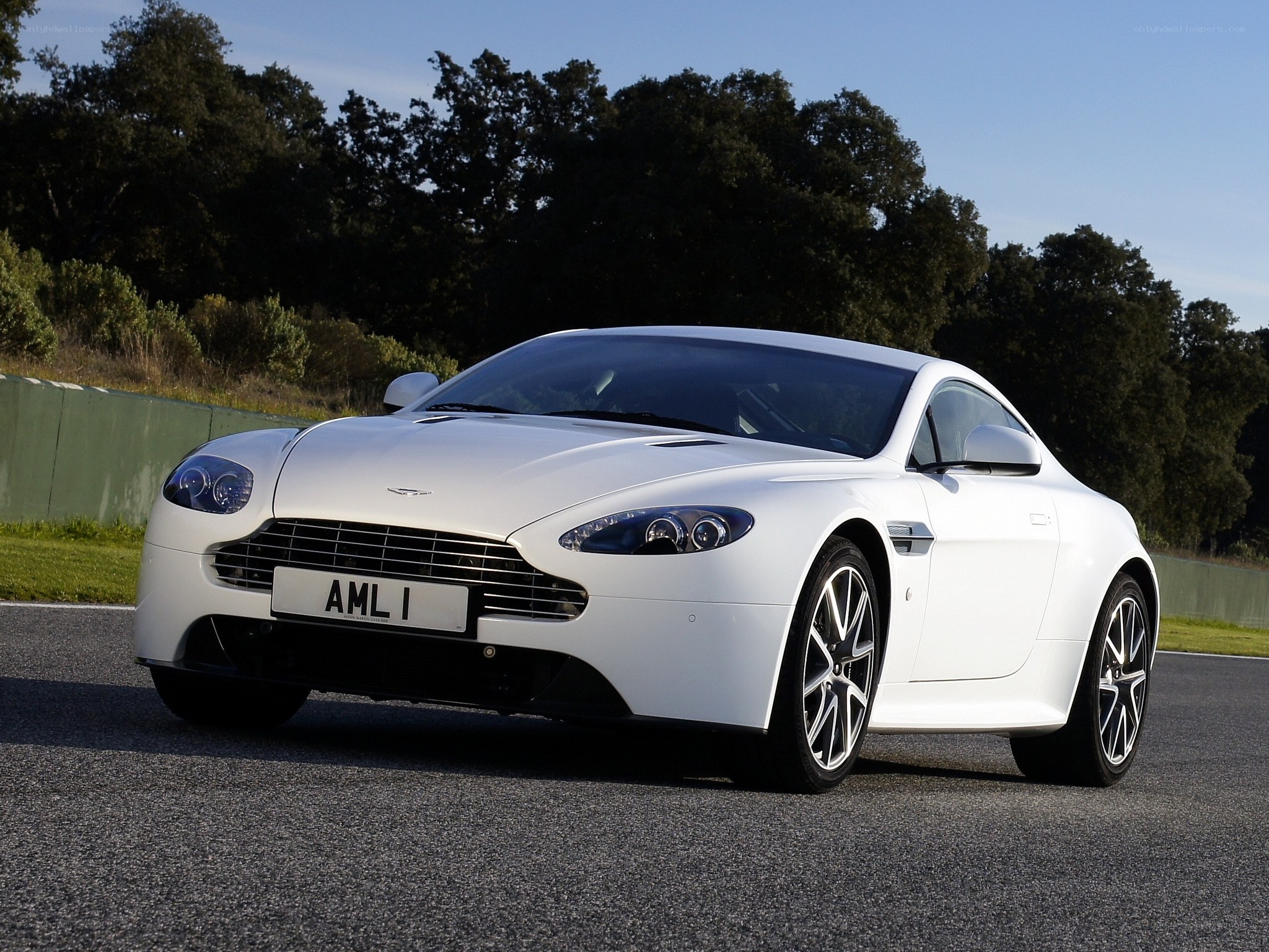 White Aston Martin on a racetrack