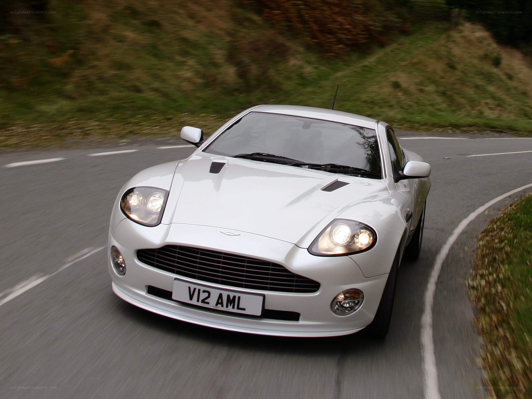 white aston martin on road