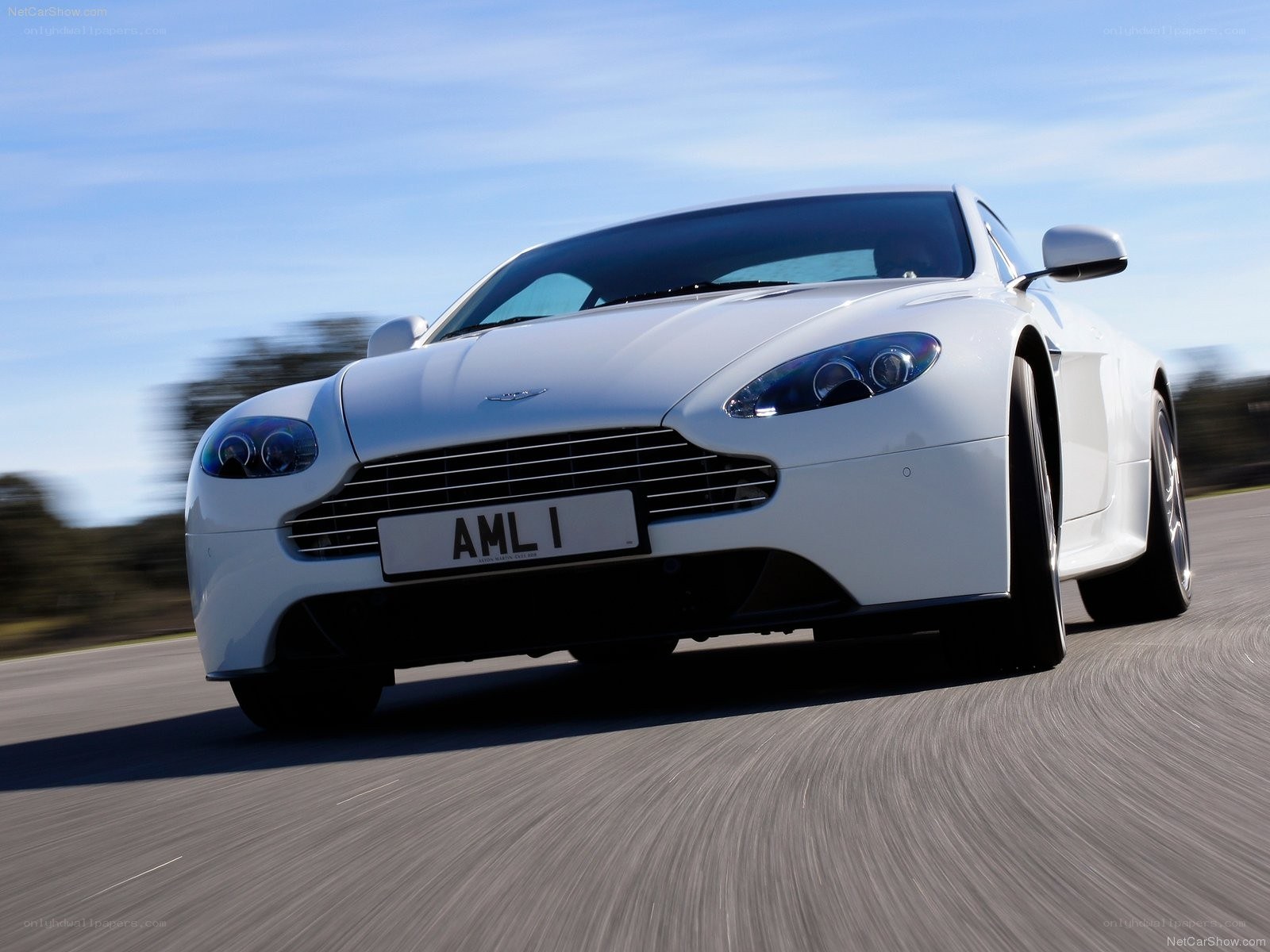 white aston martin on road