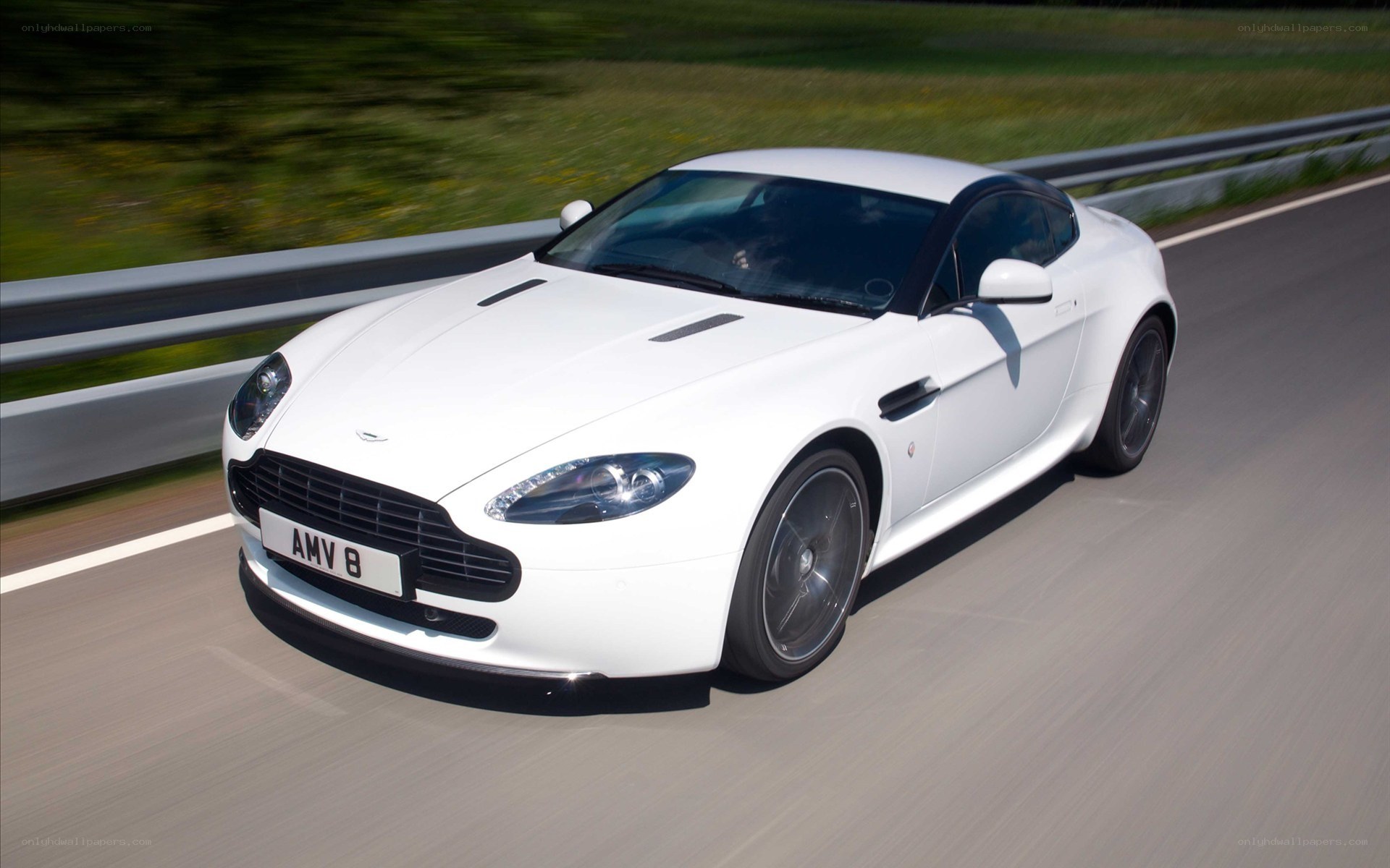 white aston martin on road