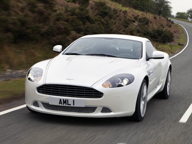 white aston martin on road