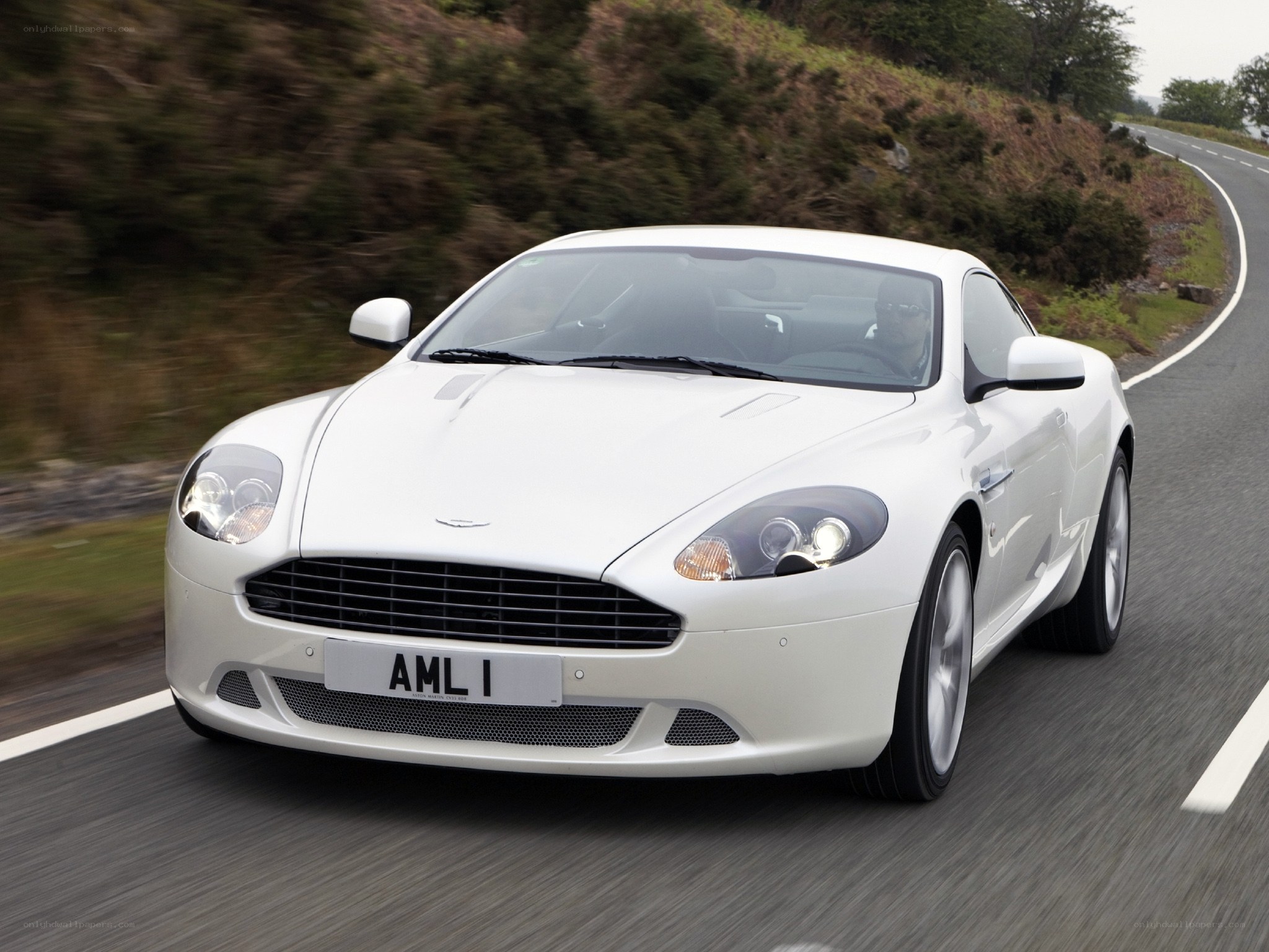 white aston martin on road