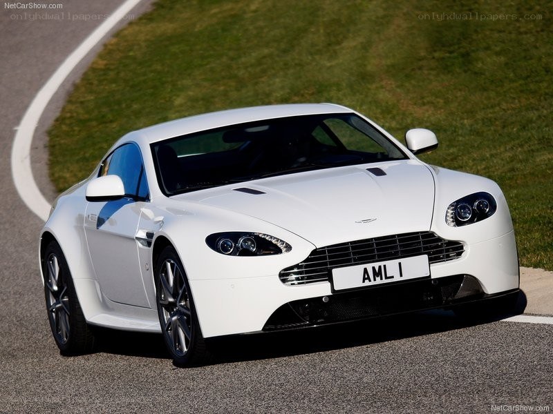 white aston martin on track